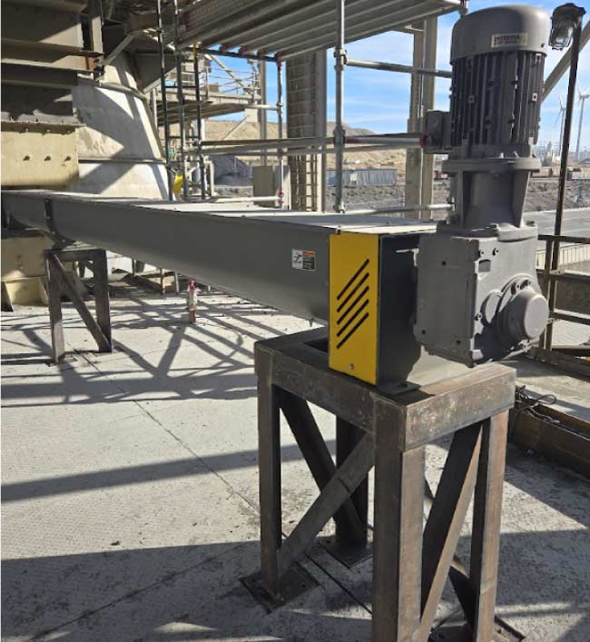metal-fabrication Custom metal industrial fabrication conveyor equipment with motor assembly, installed on-site during a facility turnaround.