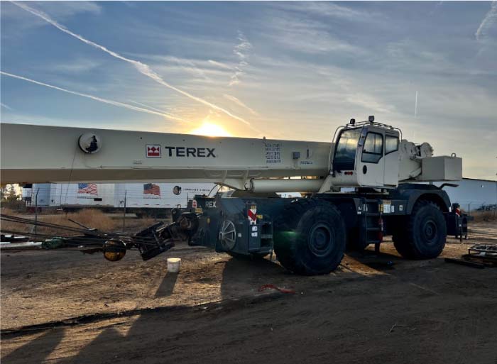 RAW Welding Inc. industrial crane positioned for turnaround or maintenance project services at sunset.